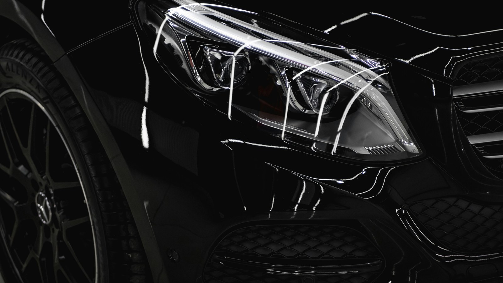 Glossy black car with a flawless protective finish